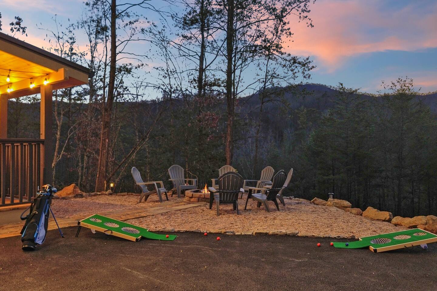 Fire pit seating and outdoor games at dusk
